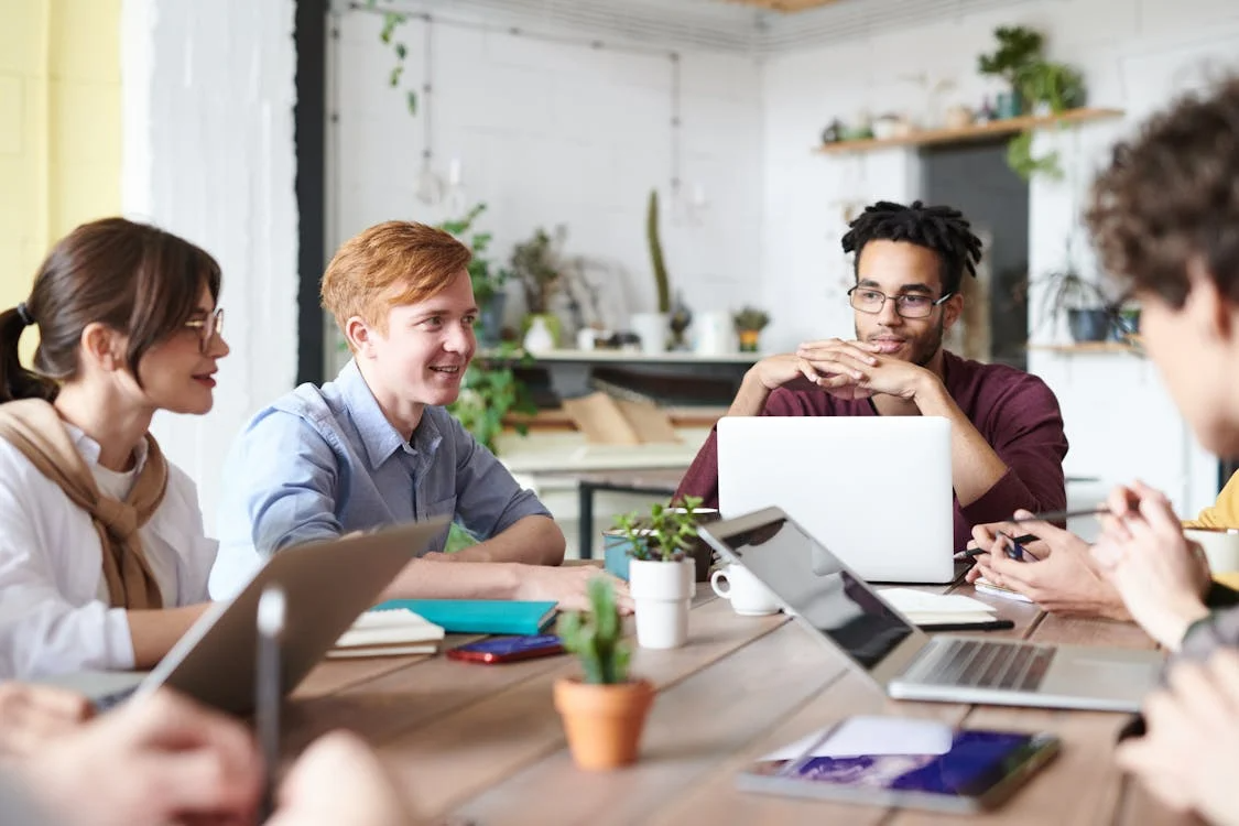 a group of people in a meeting.