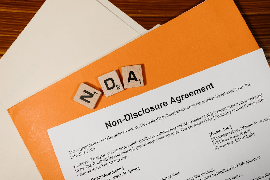Close-up of a business contract labelled Non-Disclosure Agreement on a desk