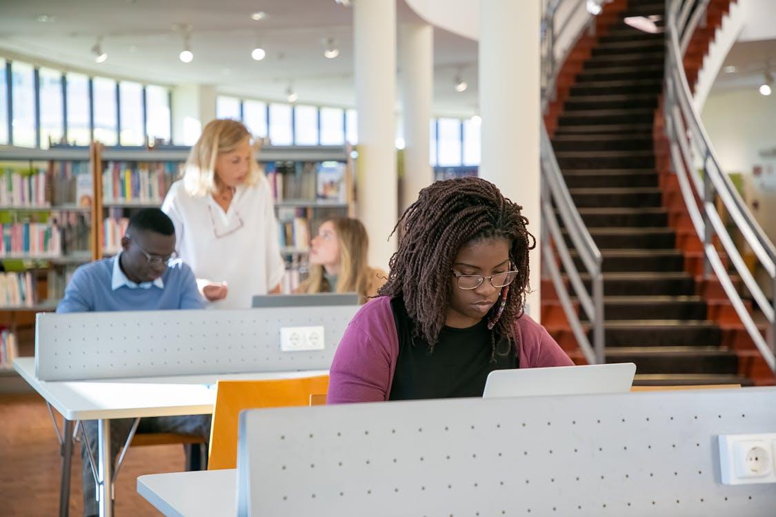 An international student studying in a library